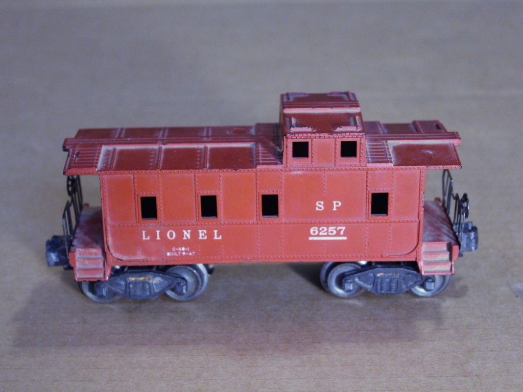 The Lionel 6257 caboose will be used as power unit. The shell is removed in place of a custom-made shell, for added space for the dead-rail components.